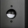 A close-up of a black outdoor light fixture with a motion sensor. Náhľad obrázku produktu