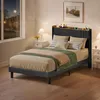 A bedroom scene at night with a bed, nightstands, and a window showing a street view. Anteprima dell’immagine prodotto