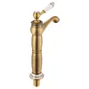 A single bronze faucet with a white ceramic handle with blue floral accents, set against a white background. Podgląd zdjęcia produktu