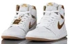 A pair of white and gold Nike Air Jordan 1 Retro High sneakers. Podgląd zdjęcia produktu