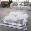 A modern living room with a sofa, rug, and shelving unit. Produktbild-Vorschau
