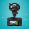 A dashcam and its suction cup mount are shown against a light blue background, with labels pointing out various features. Produktbild-Vorschau