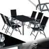 A black dining set with a glass table and six chairs, set against a white background. Produktbild-Vorschau