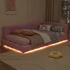 A pink upholstered bed with LED lighting in a bedroom setting. Náhled obrázku produktu