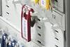 A close-up view of a key organizer with several key tags attached. Produktbild-Vorschau