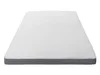 A white mattress topper with a gray border is shown from a slightly elevated angle against a white background. Náhled obrázku produktu