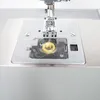 Close-up of a sewing machine's bobbin area. Anteprima dell’immagine prodotto