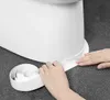 Hands applying a white sealing tape to the base of a toilet. Náhľad obrázku produktu