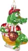 A glass Christmas ornament shaped like a cartoon alligator wearing a baseball uniform and cap, holding a baseball. Náhled obrázku produktu