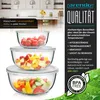 A stack of three glass bowls filled with various fruits and vegetables, set against a kitchen background and marketing text. Náhled obrázku produktu