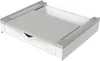 A white and gray appliance accessory, possibly a stacking kit for a washing machine, shown from a slightly elevated angle. Voir les images du produit