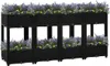 A row of black modular raised garden beds filled with purple and yellow flowers. Náhľad obrázku produktu