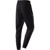 A back view of black Under Armour jogger pants against a white background. Produktbild-Vorschau