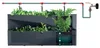 A diagram showing a modular vertical garden system with plants and an integrated irrigation system. Anteprima dell’immagine prodotto
