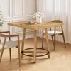 A wooden dining table with two chairs in a well-lit room with a plant and curtains. Podgląd zdjęcia produktu