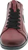 A close-up, front view of a red leather shoe with black laces. Produktbild-Vorschau