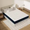 A mattress is shown on a bed frame in a bedroom setting. Voir les images du produit