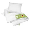 A white pillow and folded white duvet are arranged on a white background, with a green label attached to the duvet. Náhľad obrázku produktu