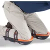 A person kneeling on the floor wearing knee pads. Anteprima dell’immagine prodotto