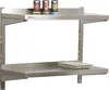 A stainless steel shelf mounted on a wall with three canisters and two plates on it. Produktbild-Vorschau