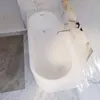 Ambiente Bild einer weißen Badewanne in Seitenansicht  in hellem, modernem Badezimmer. Produktbild-Vorschau