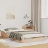 A bedroom scene with a wooden bed frame and bedding. Náhled obrázku produktu