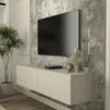 A modern living room setup featuring a wall-mounted TV and media console. Anteprima dell’immagine prodotto