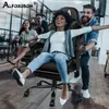 People are having fun riding in gaming chairs. Produktbild-Vorschau