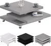 A grey, high-gloss, multi-tiered coffee table with chrome legs, displayed on a white background. Two coffee cups and a small candle holder with a lit candle are placed on the top tier, and a stack of books is on the middle tier. Below the main product imag Produktbild-Vorschau