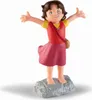 A small figurine of the character Heidi standing on a rock with her arms outstretched. Produktbild-Vorschau