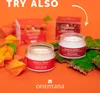 Two jars of face cream are displayed with boxes in the background, surrounded by decorative elements like moss and dried flowers. Produktbild-Vorschau
