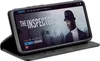 A smartphone in a black flip case is displayed, showing a movie streaming interface on its screen. Produktbild-Vorschau