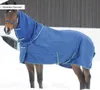 A horse wearing a blue turnout rug in a snowy environment. Produktbild-Vorschau