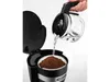 A hand is pouring water from a coffee pot into a coffee maker with coffee grounds in a filter. Náhľad obrázku produktu