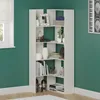A white corner bookshelf filled with decorative items and books, set against a dark green wall. Produktbild-Vorschau