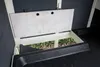 A close-up view of an open nesting box or compartment within a wooden animal hutch. Voir les images du produit