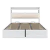 A white bed frame with a beige upholstered headboard is shown against a white background. Anteprima dell’immagine prodotto