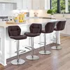 A kitchen island with four brown bar stools in front of it. Produktbild-Vorschau