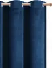 A close-up view of a dark blue velvet curtain with grommets. Anteprima dell’immagine prodotto