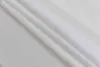 A close-up, diagonal view of white fabric with folds. Produktbild-Vorschau