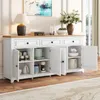 A white sideboard with a wooden top, displaying various kitchen appliances and decorative items inside its open compartments. Anteprima dell’immagine prodotto