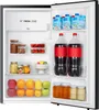 The inside of an open refrigerator is shown, displaying various food and beverage items. Produktbild-Vorschau