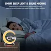 A woman sleeping in bed next to a smart sleep light and sound machine. Produktbild-Vorschau