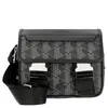 A studio shot of a black and gray Lacoste messenger bag with a geometric pattern. Anteprima dell’immagine prodotto