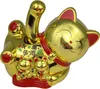 A golden Maneki-neko (lucky cat) figurine with a waving paw, sitting on a red base. Produktbild-Vorschau