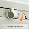 A close-up view of a bidet toilet seat control panel, showing a dial and indicator lights with icons representing water pressure and spray functions. An orange arrow indicates a downward motion. Anteprima dell’immagine prodotto