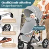A baby in a stroller with a person pushing it in an outdoor setting. Produktbild-Vorschau