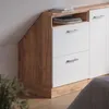 A close-up view of a white and wood-tone cabinet with drawers, set against a light gray wall. Podgląd zdjęcia produktu