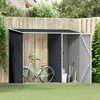 A garden shed with a bicycle and gardening tools in a backyard setting. Podgląd zdjęcia produktu