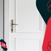 A close-up of a white door with a bronze door handle and keyhole. Anteprima dell’immagine prodotto